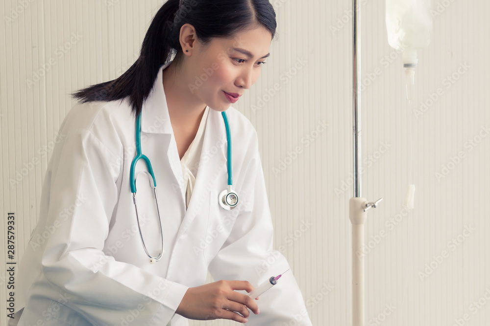 Young Asian psychiatrist doctor sitting on the chair in the hospital. Young Asian psychiatrist doctor sitting on the chair in the hospital.