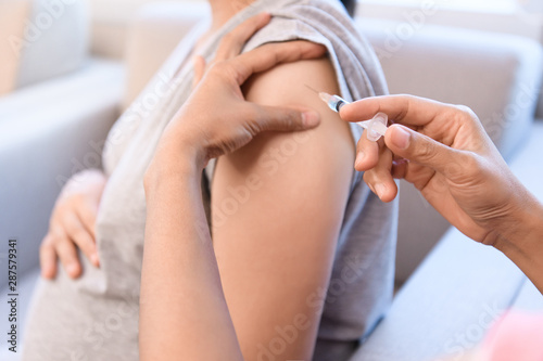Pregnant women get flu and measles vaccine shot  medicine and drug concept