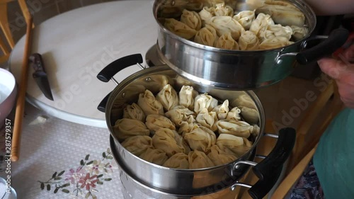 Central Asian food culture Uzbek ravioli in steam pot, photo