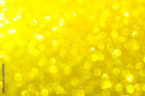 gold bright festive background for Christmas. gold glitter sparkles ray lights bokeh background With Blinking light.can be used for background or wallpaper.