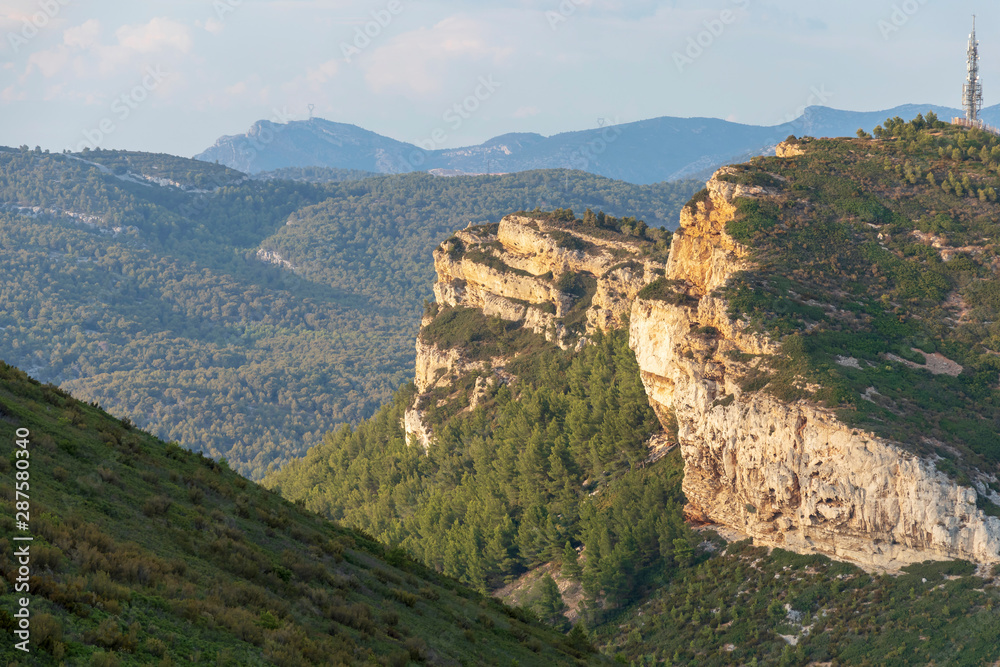 Sandstone cliffs and green forest of Cap Canaille, Falaises Soubeyranes, Southern France