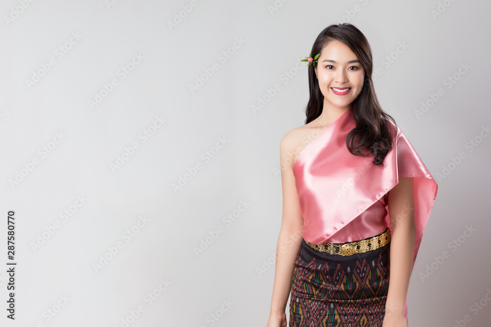 Young beautiful Thai women in tradition costumes isolated on white, portrait Asian adult lifstyle. Young beautiful Thai women in tradition costumes isolated on white, portrait Asian adult lifstyle.