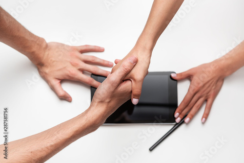 Close up top view of male and female hands shaking over the table  planning strong business working relationships  showing respect. Successful deal  greeting and partnership concept