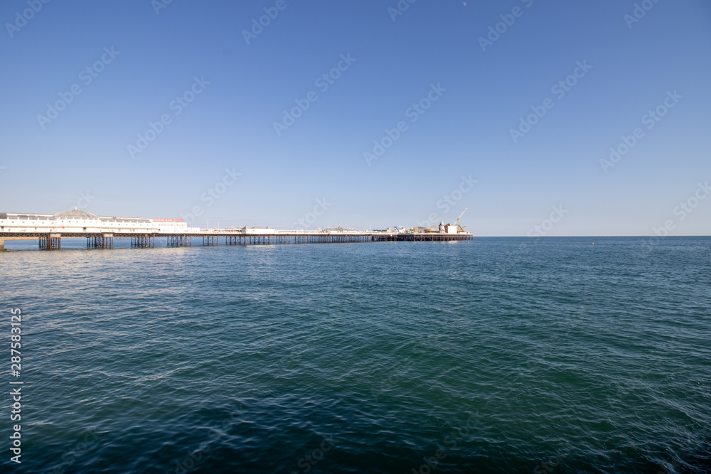 Brighton UK, 10th July 2019: The famous beautiful Brighton Beach and Seafront showing the coastline area on a bright sunny day.