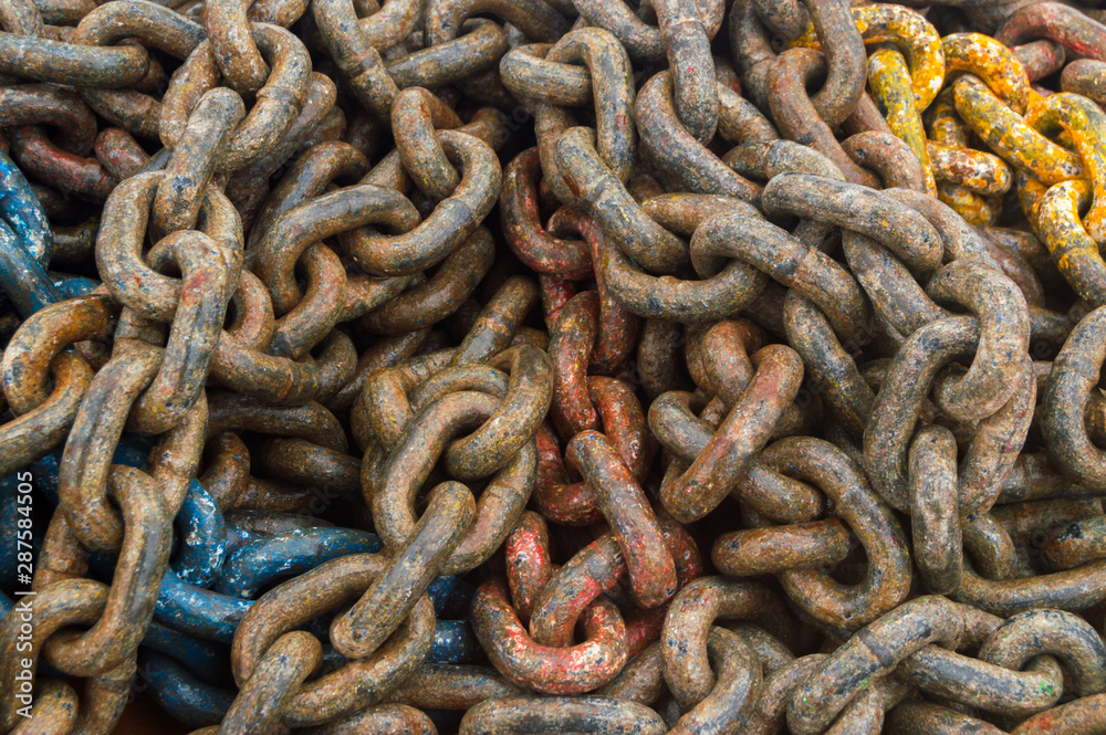 Anchor chain over an old pallet in the port. Anchor chain over an old pallet in the port.