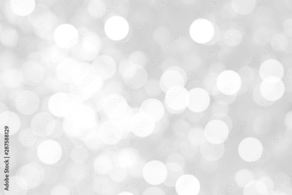 Abstract background with White bokeh on gray background. christmas blurred beautiful shiny Christmas lights. Abstract background with White bokeh on gray background. christmas blurred beautiful shiny Christmas lights.