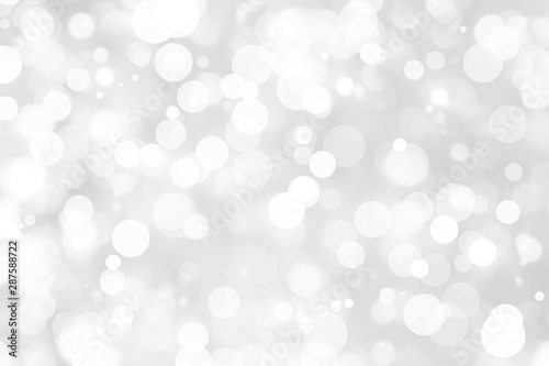 Abstract background with White bokeh on gray background. christmas blurred beautiful shiny Christmas lights.