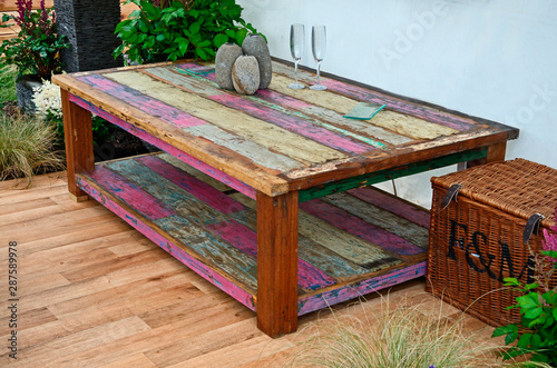 Εκτύπωση καμβά A large coffee table stained and made from reclaimed timber with accessories on