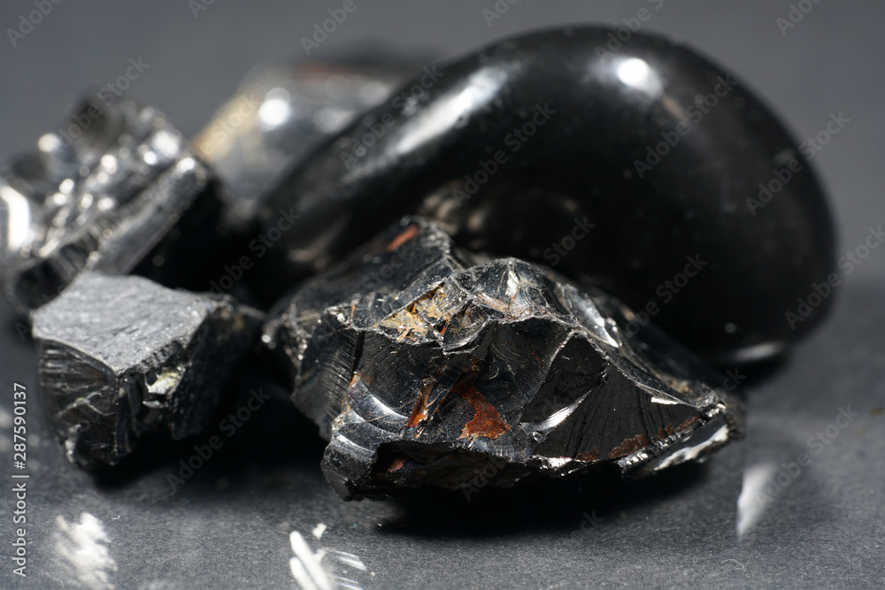 A black rock also called healing stone shungite, which consists mainly of carbon was photographed here in top quality. A black rock also called healing stone shungite, which consists mainly of carbon was photographed here in top quality.