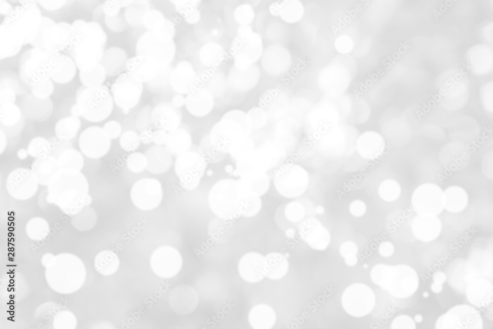 Abstract background with White bokeh on gray background. christmas blurred beautiful shiny Christmas lights. Abstract background with White bokeh on gray background. christmas blurred beautiful shiny Christmas lights.