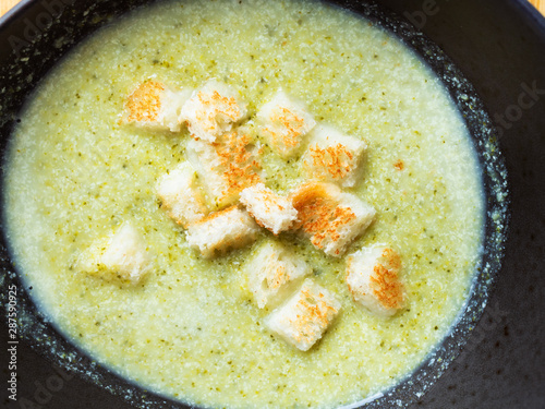 broccoli puree soup with croutons close-up