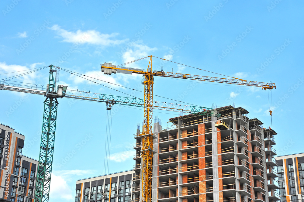 Crane and highrise construction site Crane and highrise construction site