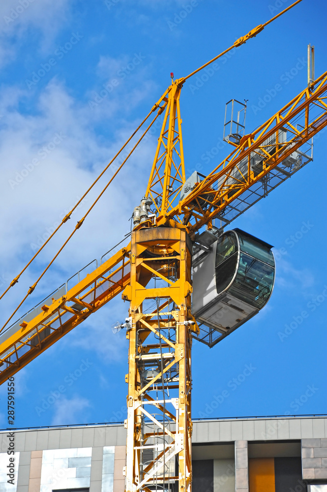 Crane and highrise construction site Crane and highrise construction site