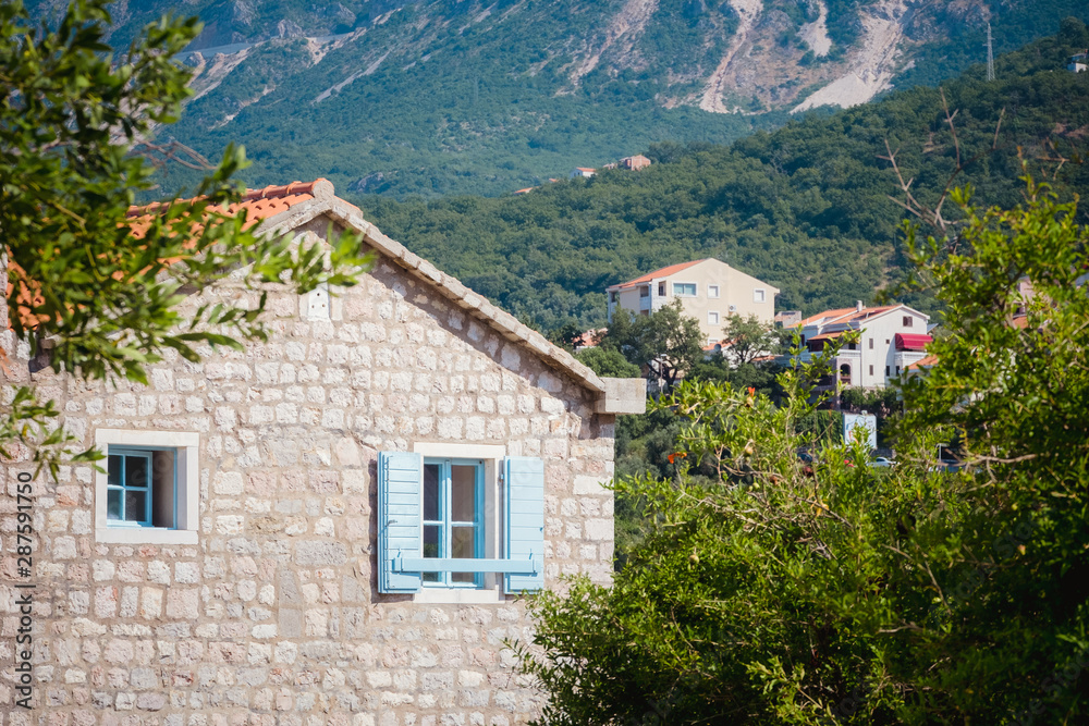 house with blue shutters in Montenegro