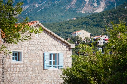 house with blue shutters in Montenegro