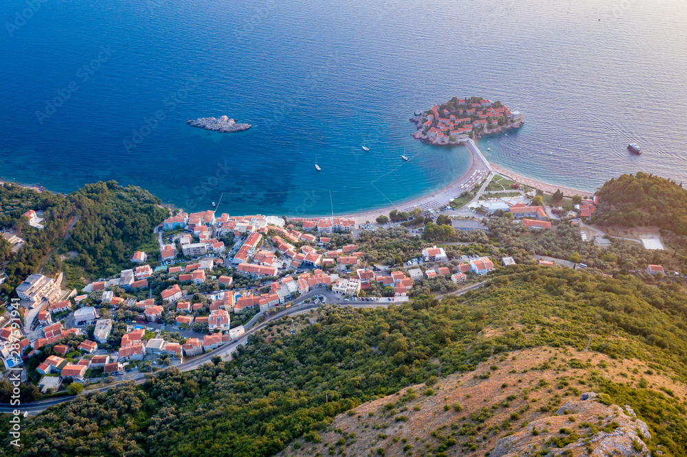 Aerial view on Sveti Stefan island with road and coastal town. Montenegro