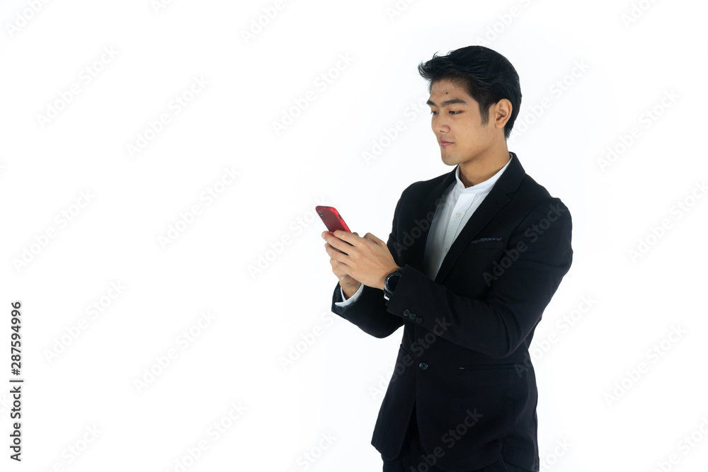 Handsome young businessman Asian caucasian wear a black suit with black hair, be a smile and standing smart poses. Hold and use a smartphone. On white background. Handsome young businessman Asian caucasian wear a black suit with black hair, be a smile and standing smart poses. Hold and use a smartphone. On white background.