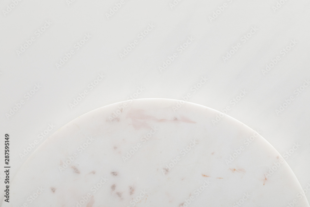 Empty flat round marble surface on white background Empty flat round marble surface on white background