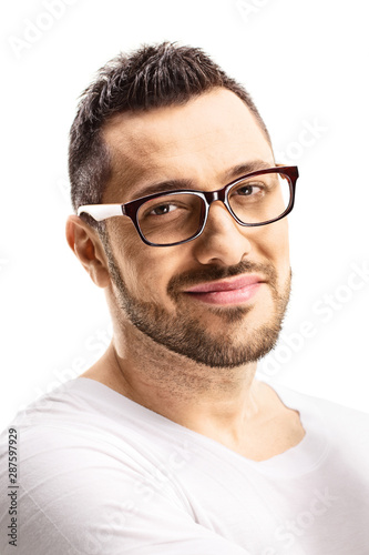 Fototapeta Naklejka Na Ścianę i Meble -  Portrait of a young handsome man in white t-shirt wearing glasses