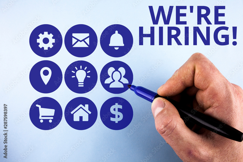 Fototapeta premium Conceptual hand writing showing We Re Hiring. Concept meaning recently employ someone or pay someone to do particular job Male designing layout presentation concept for business promotion