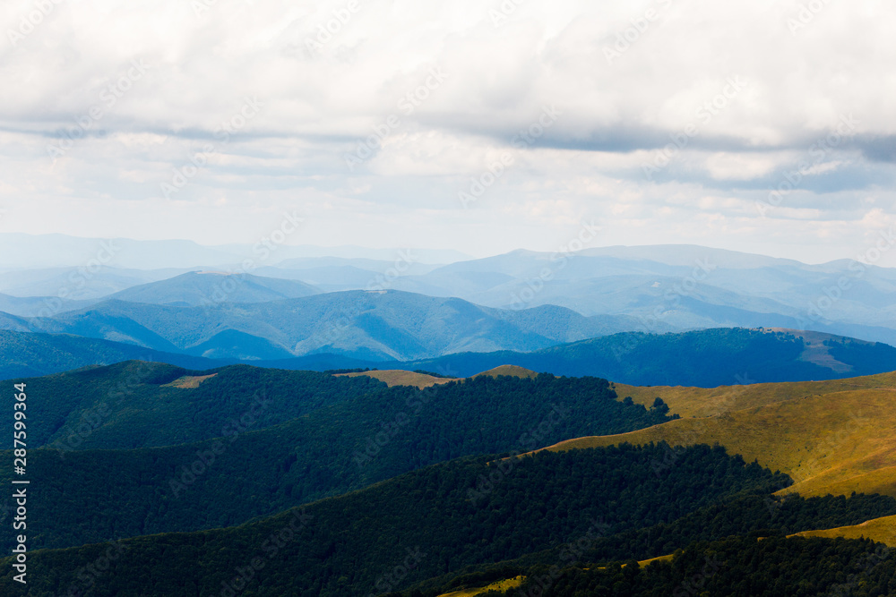 Fototapeta premium Mountain landscape with beautiful clouds before the rain. Location place Ukraine Carpathian meadow Borzhava.