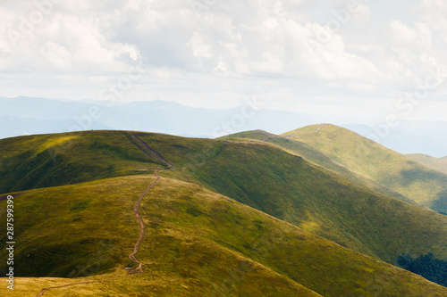 Beautiful summer landscape of Borzhava ridge rolling in the distance. © Андрей Репетий
