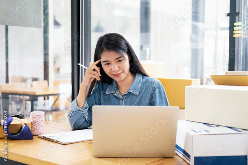 Wallpaper Mural Online small business owner checking order. Torontodigital.ca