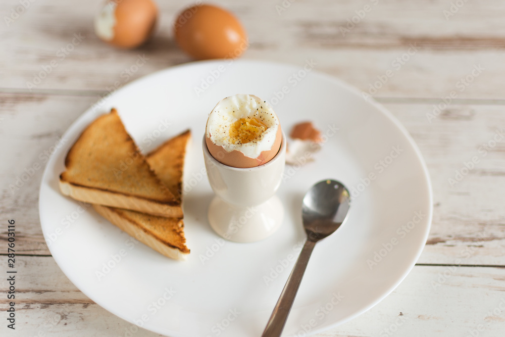 Hard boiled egg and bread sandwich with sprouted grain on a wooden table. Traditional food for healthy breakfast. Hard boiled egg and bread sandwich with sprouted grain on a wooden table. Traditional food for healthy breakfast.