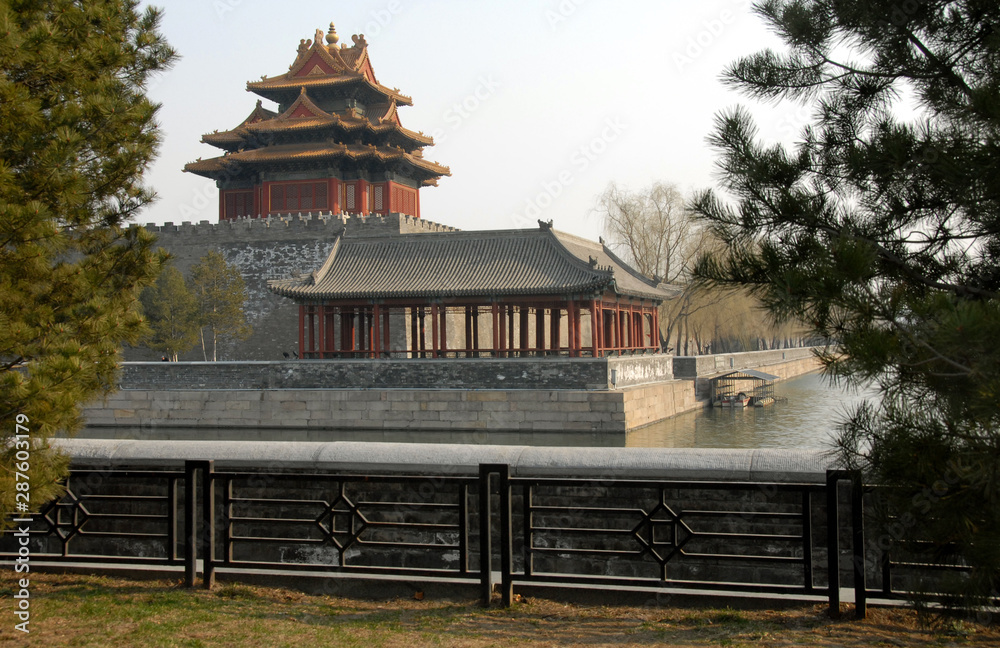 Forbidden City, Beijing, China. A corner tower seen from outside the Forbidden City. The Forbidden City has traditional Chinese architecture. The Forbidden City is also the Palace Museum, Beijing. Forbidden City, Beijing, China. A corner tower seen from outside the Forbidden City. The Forbidden City has traditional Chinese architecture. The Forbidden City is also the Palace Museum, Beijing.