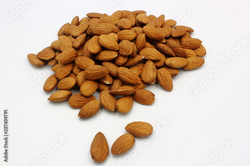 pile of almonds isolated on white background