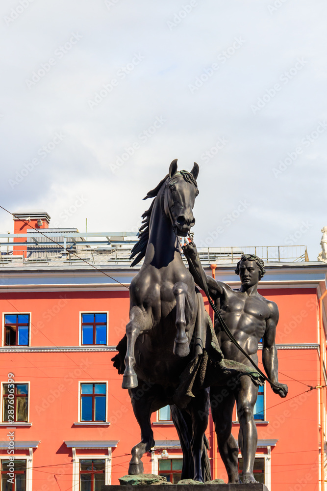 The Horse Tamers sculpture on Anichkov bridge in St. Petersburg, Russia
