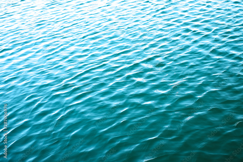 Rippled water surface with reflections.