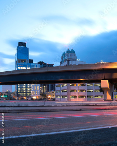 Early morning at Orlando Florida showing the freeway and various architecture and  the  .deep blue sky . © Photoman