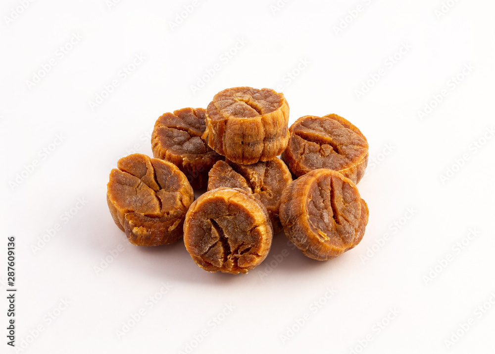 a group of dried scallops on white background a group of dried scallops on white background
