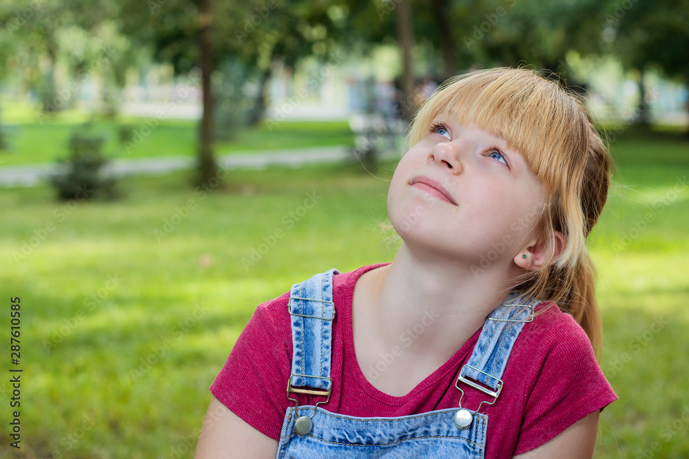 Beautiful girl with blonde hair looking up Beautiful girl with blonde hair looking up