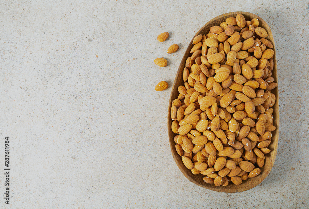 almond nuts on granite background almond nuts on granite background