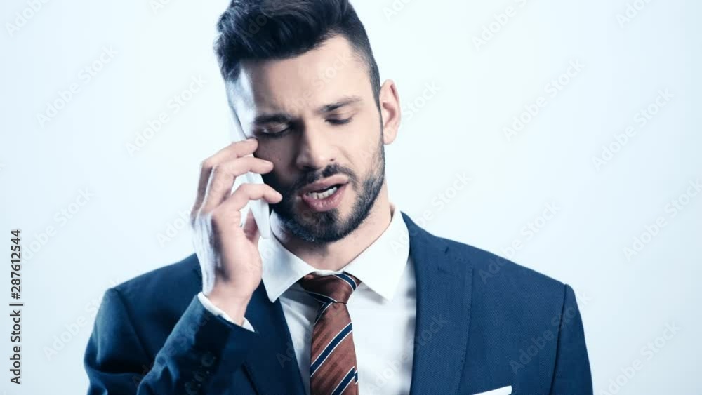 bearded man in suit talking on smartphone on white bearded man in suit talking on smartphone on white
