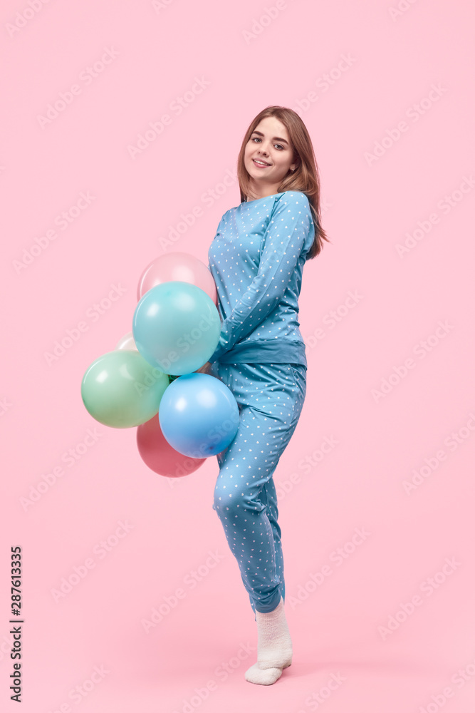 Teen girl in pajama with balloons Teen girl in pajama with balloons