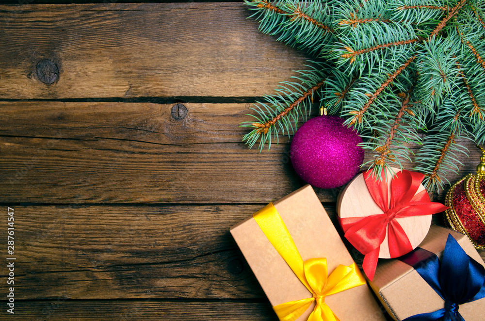 Fototapeta premium Christmas decoration and boxes on wooden background. Top view, copy space