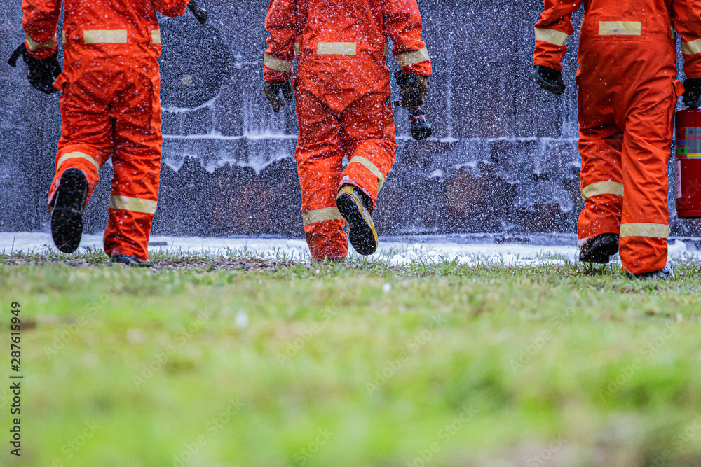 Fototapeta premium fire flighter training spray water to fire