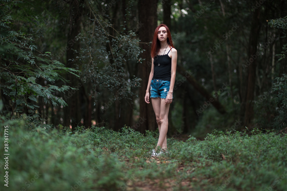 a skinny redhead girl in a brazilian forest a skinny redhead girl in a brazilian forest