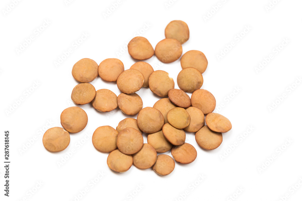 Isolated stack of uncooked lentils on white background from above. Isolated stack of uncooked lentils on white background from above.