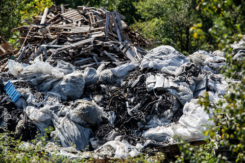 environmental pollution in nature, car and machinery parts and garbage thrown into the nature.