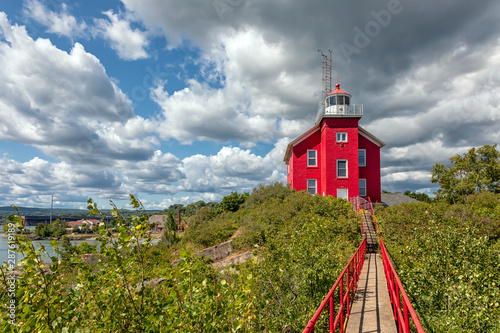 Marquette Harbor Lighthouse with catwalk on a sunny summer day