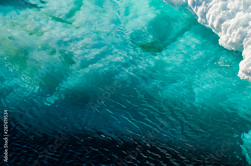Floating iceberg in the Arctic Ocean, Svalbard, Norway. photo
