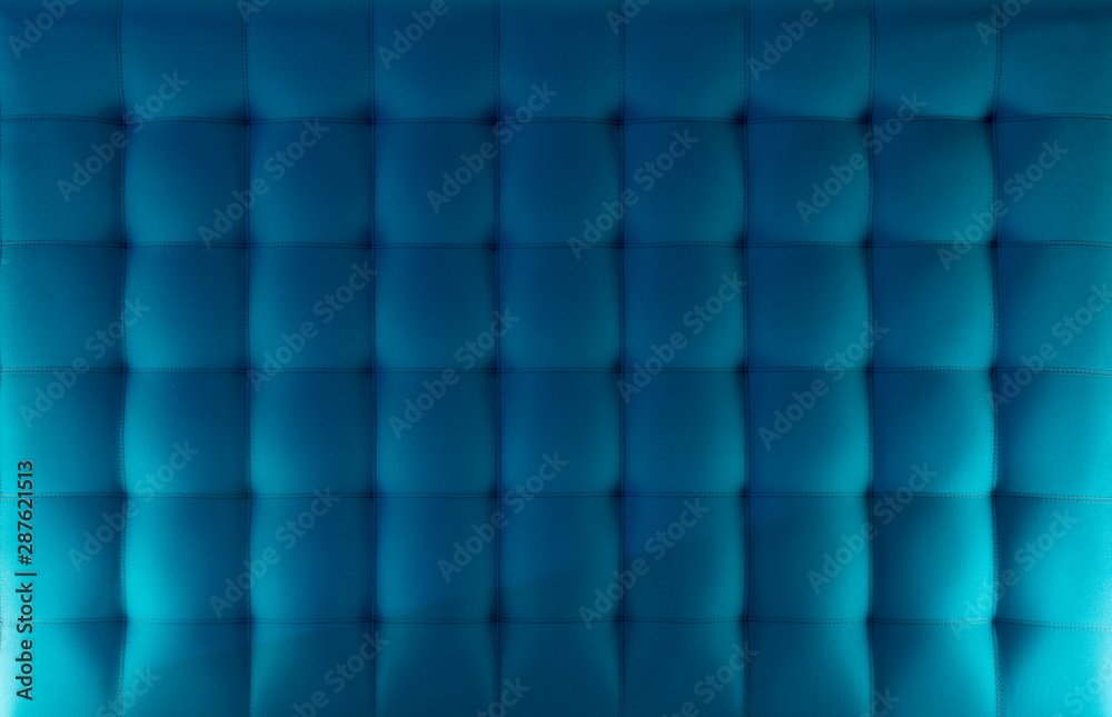 Pattern of a blue cloth upholstered headboard Pattern of a blue cloth upholstered headboard