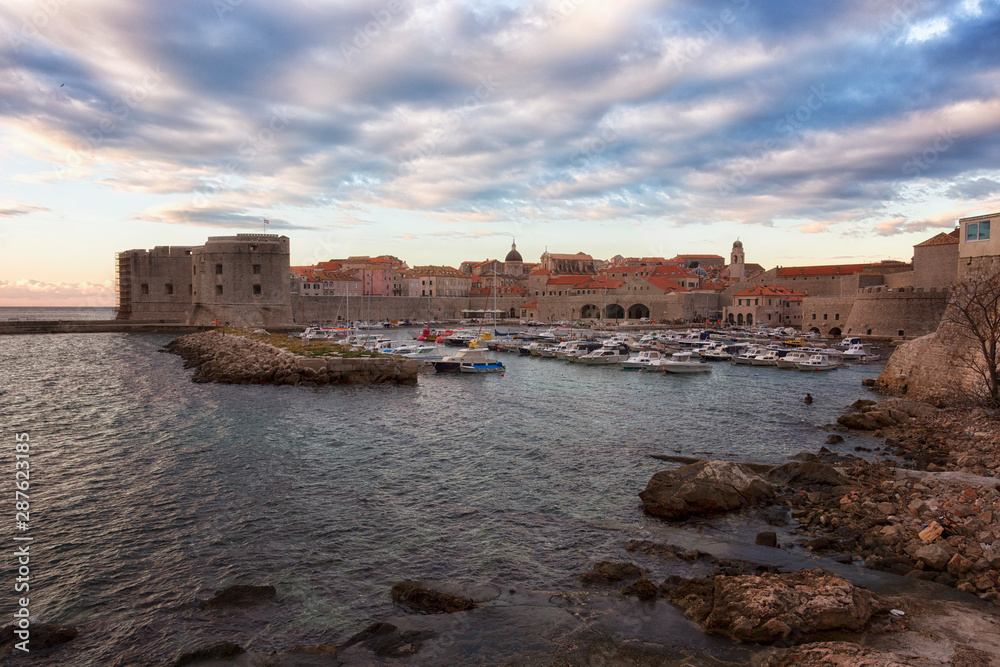Dubrovnik, a landscape overlooking the old town and large stones in the foreground, Croatia