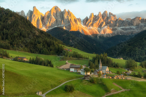 Santa Maddalena village in front of the Geisler or Odle Dolomites Group , Val di Funes, Italy, Europe. photo