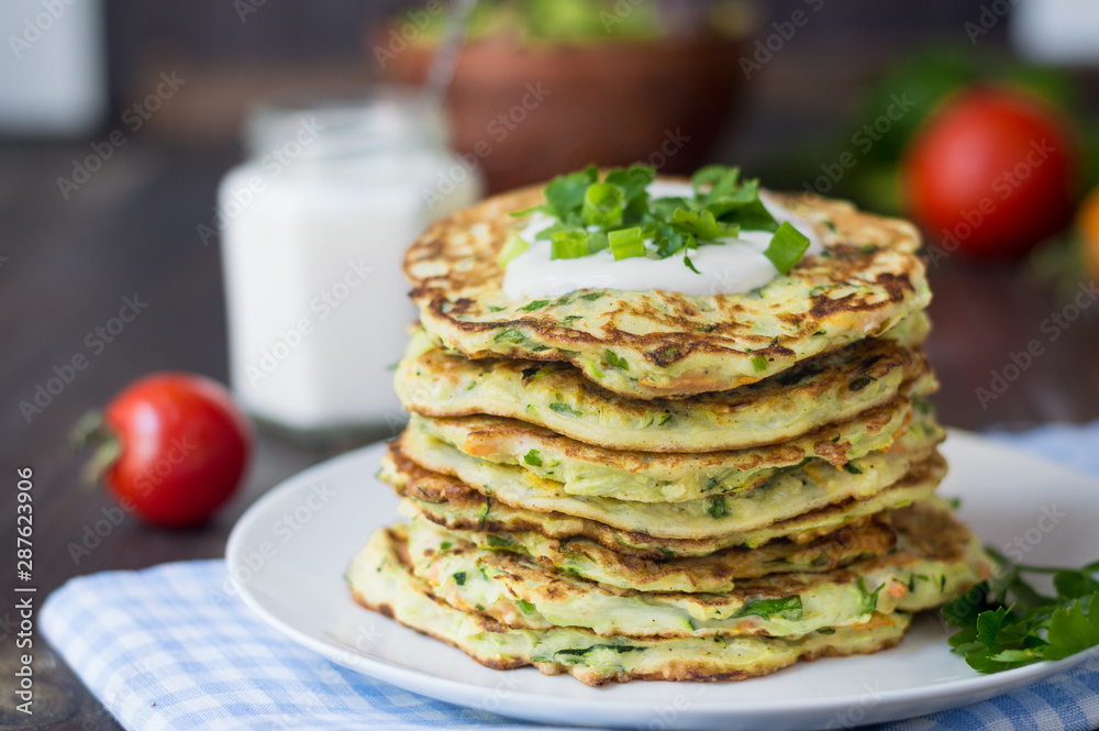 zucchini fritters healthy vegetable recipe, ingredients are zucchini, carrots, garlic, parsley and eggs zucchini fritters healthy vegetable recipe, ingredients are zucchini, carrots, garlic, parsley and eggs