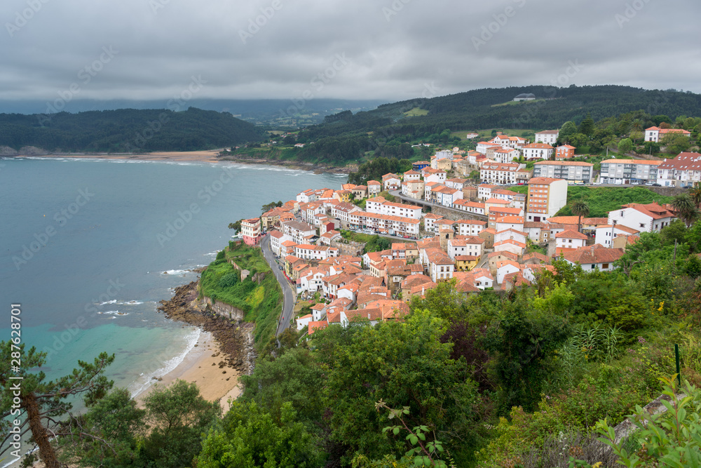 View of lastres a fishermen village in Asturias, Spain. white village houses with red roofs